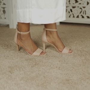VINCE CAMUTO Nude faux leather open toe heels.